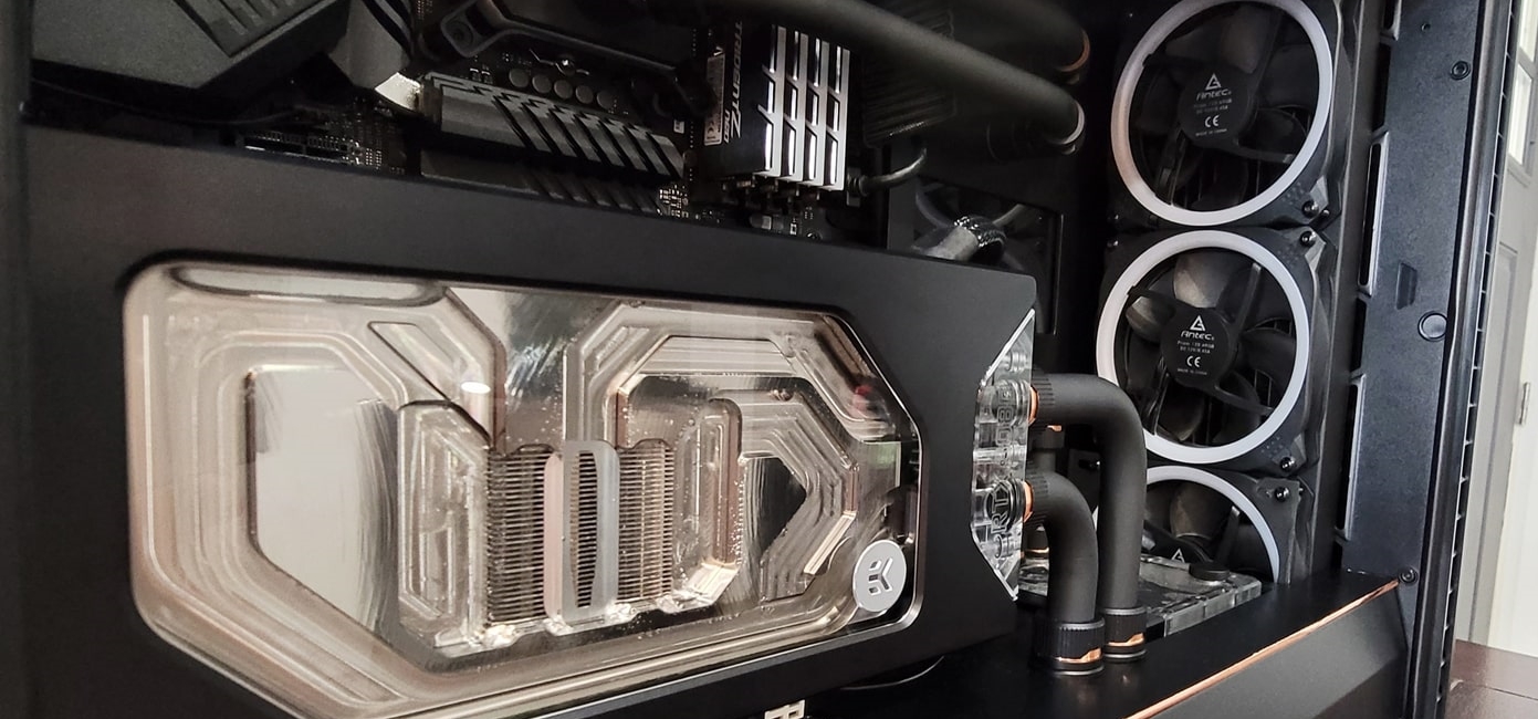 Full-cover GPU block inside a custom water-cooled PC